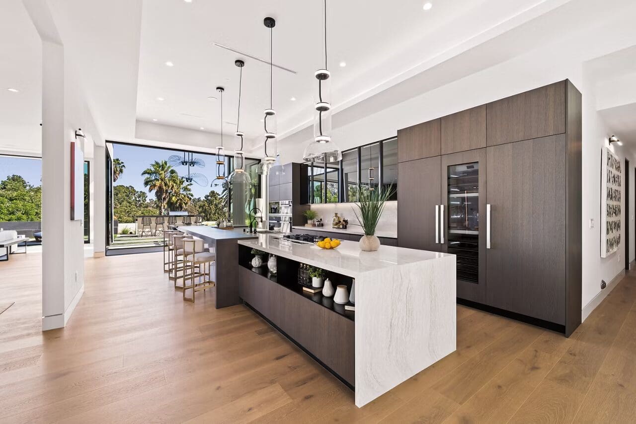 A large kitchen with a big island and lots of counter space.