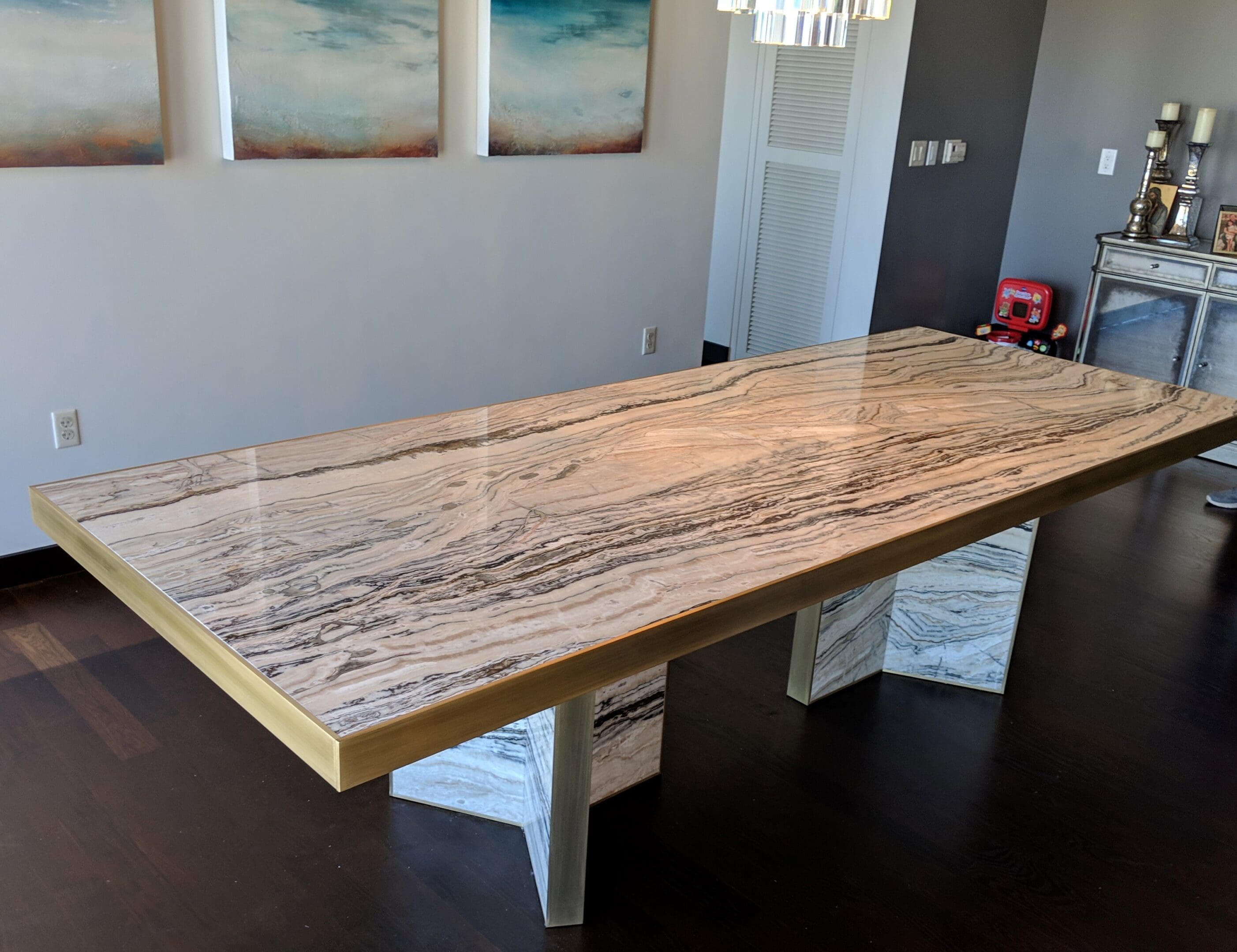 A large wooden table with white base and wood top.