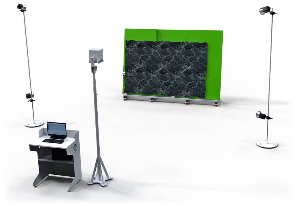 A computer desk with a laptop and a green cabinet