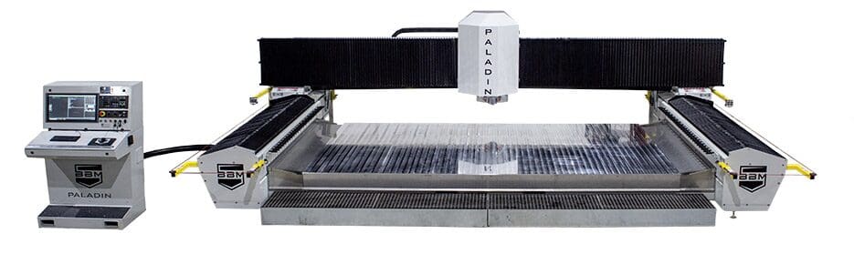 A machine that is cutting paper on top of the table.